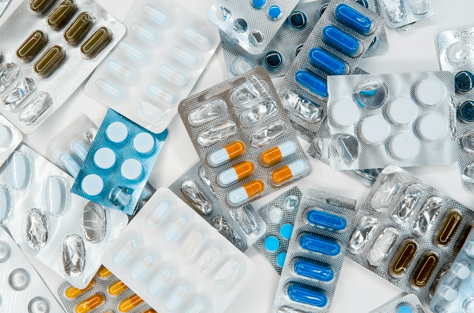 Pile of medication tablets on a table